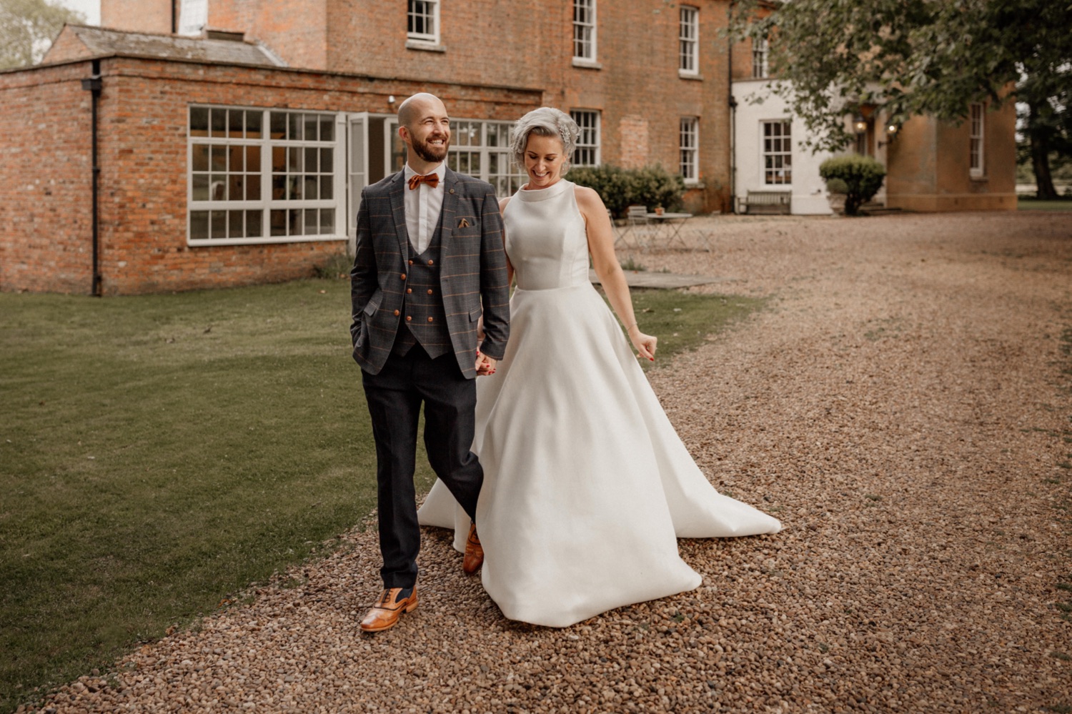 63_couple walking at aswarby rectory wedding in Lincolnshire couple walking at aswarby rectory wedding in Lincolnshire
