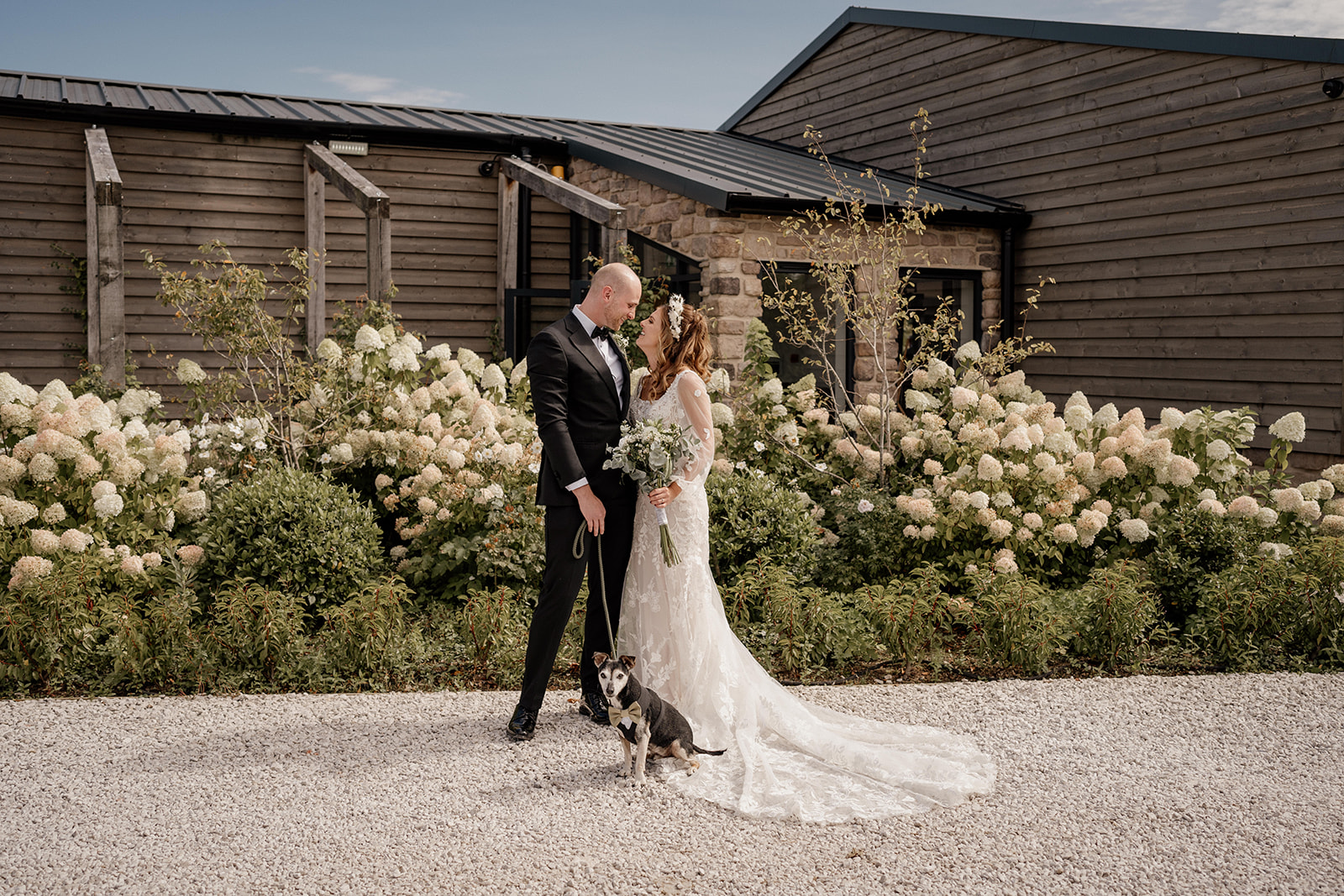 Couple and their dog at Stretton Manor Barn wedding in Derbyshire