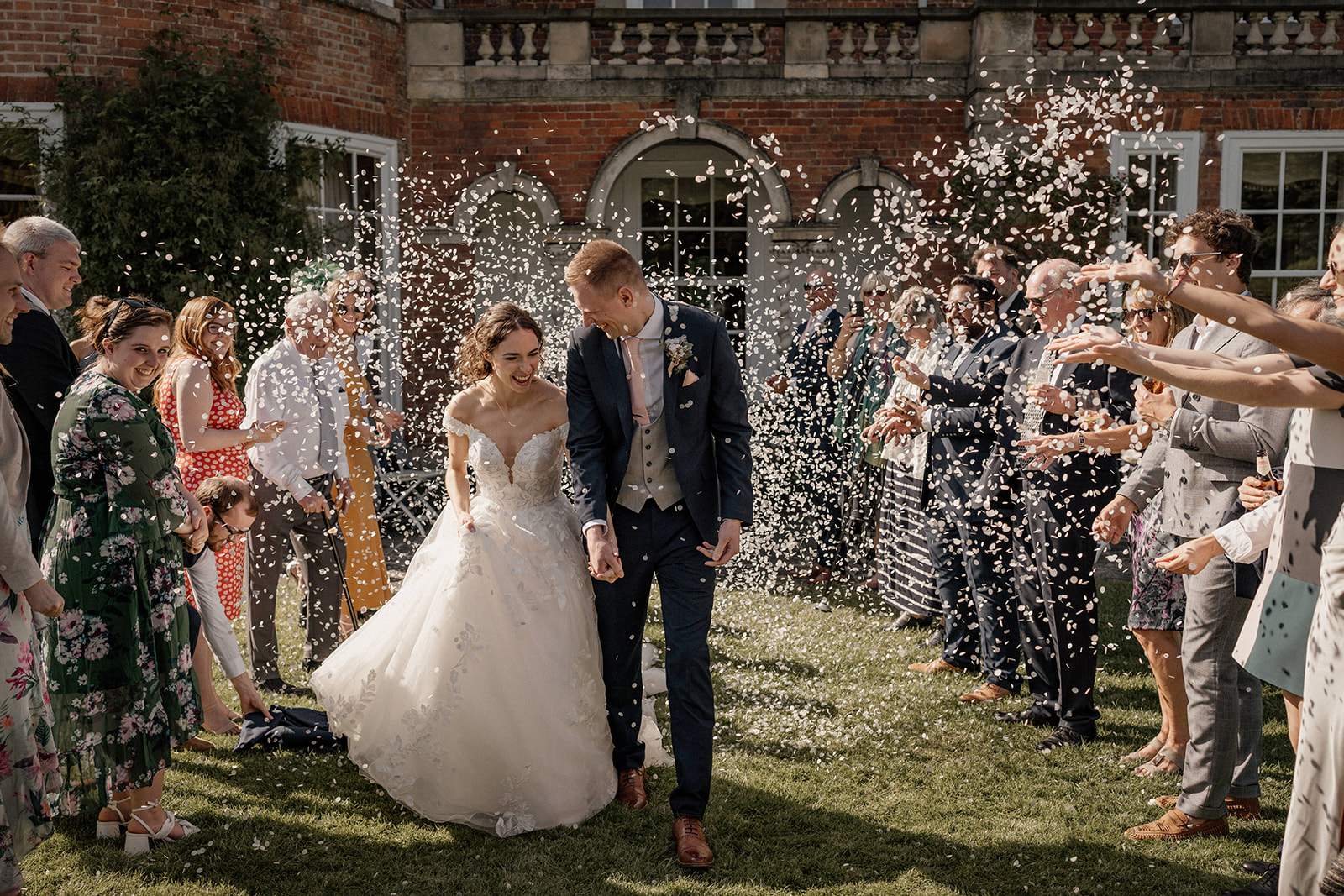 Confetti tunnel at Sutton Bonington Hall wedding in Leicestershire