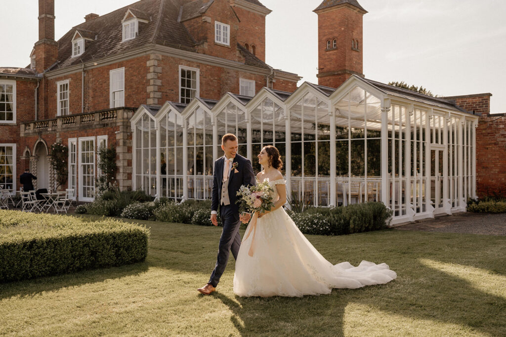 Couple laugh on wedding day at Sutton Bonington Hall Leicestershire