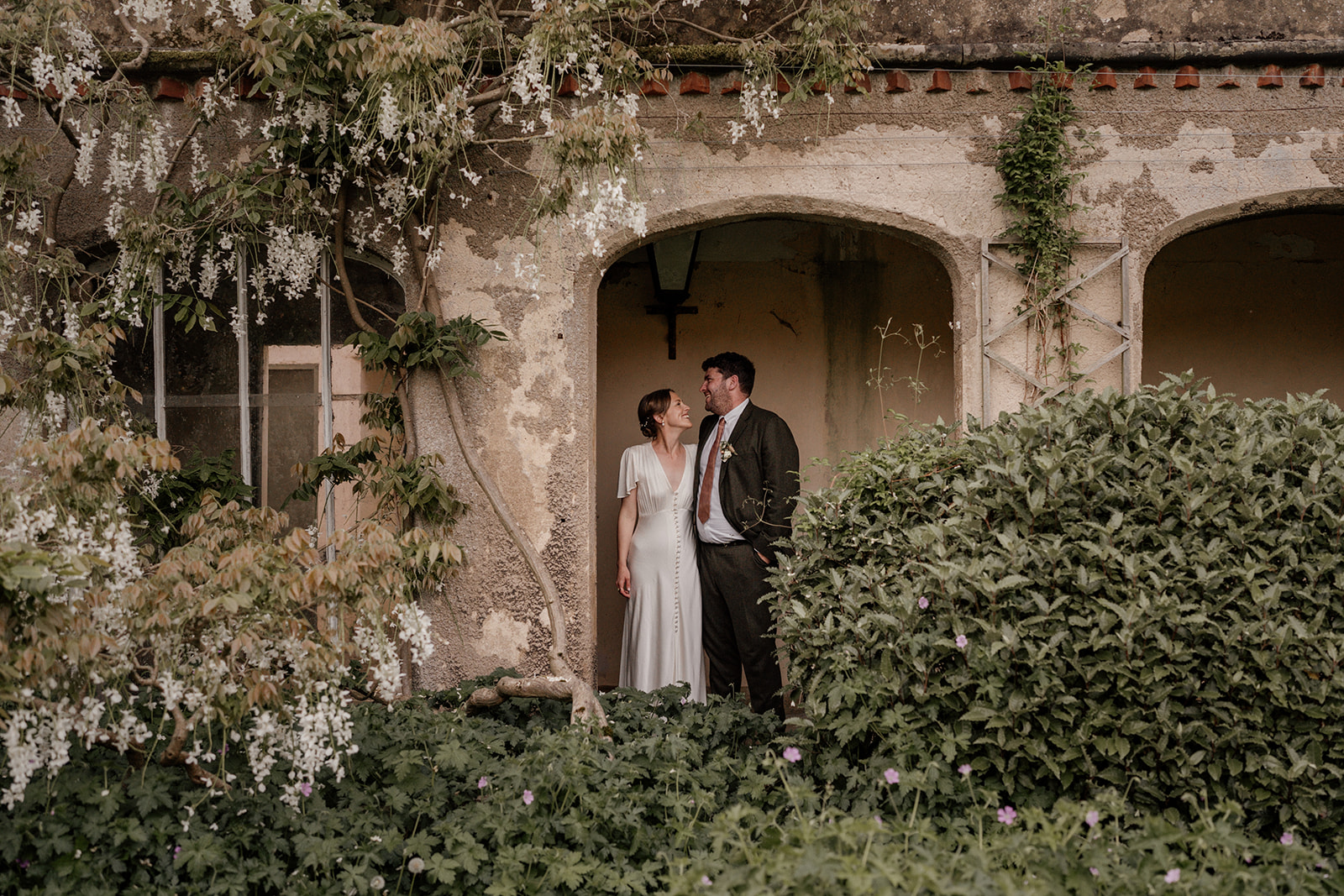 A couple pose for their portrait at Holme Pierrepont Hall wedding