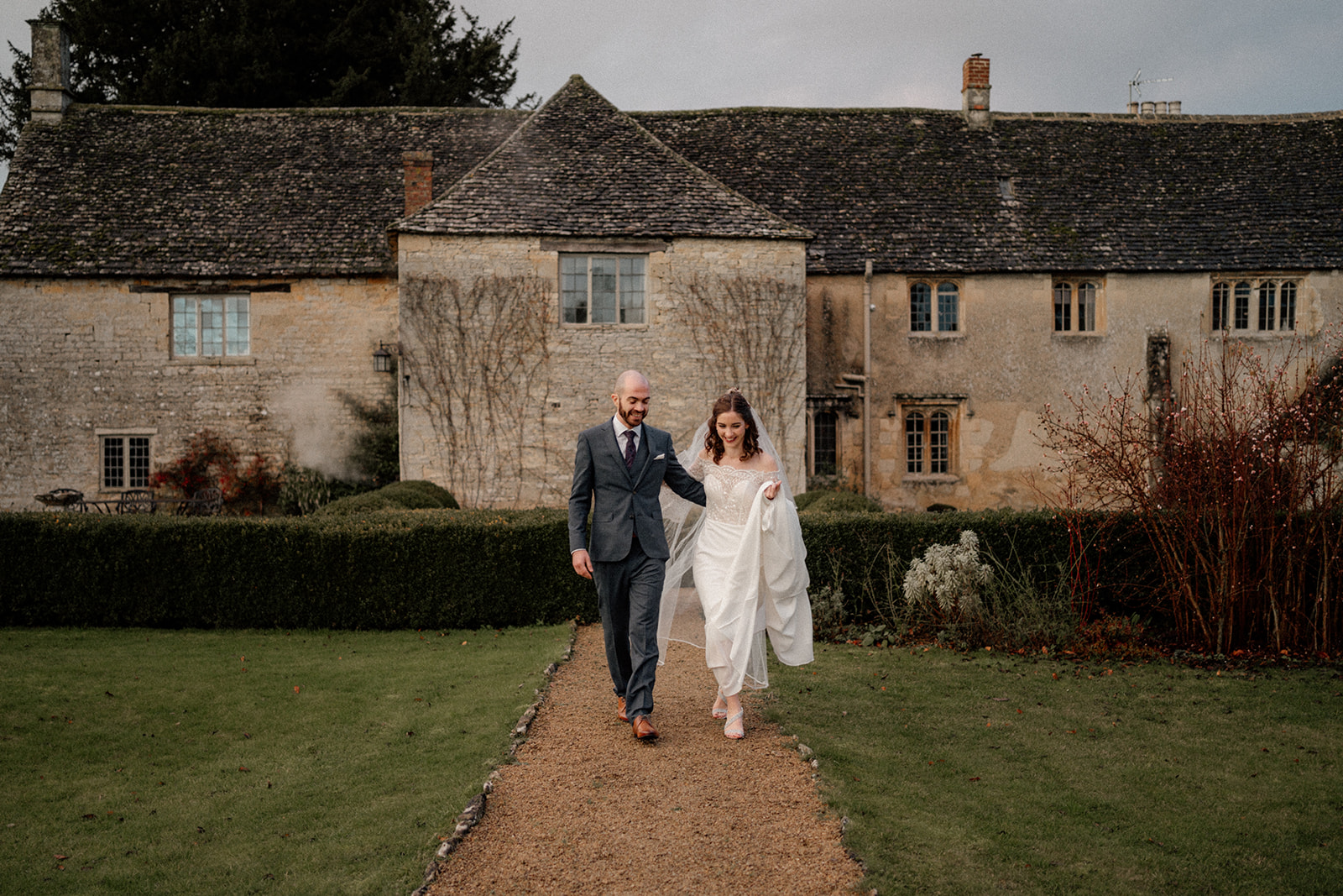 couple walking outside planning a winter wedding at caswell house