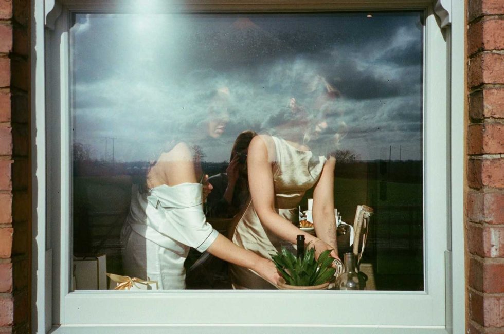bride photographed through window on analogue 35mm film