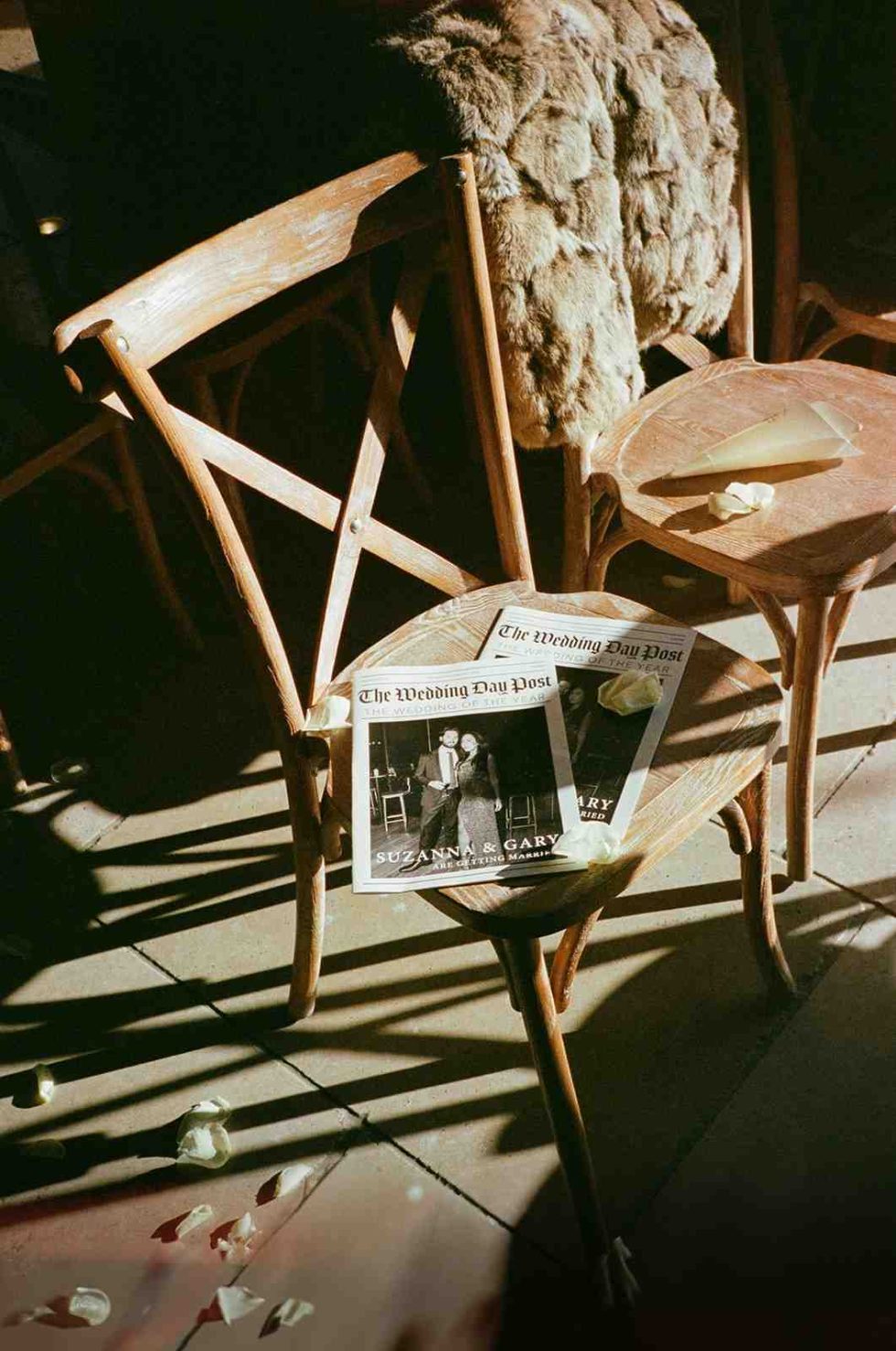 wedding newspaper bathed in winter light captured on 35mm film