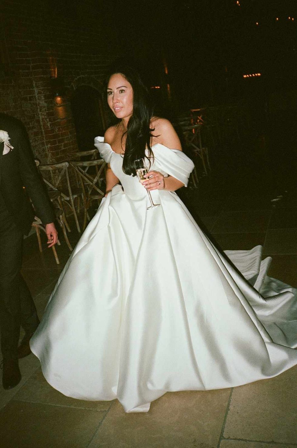 bride walks through barn captured on 35mm film at grangefields wedding