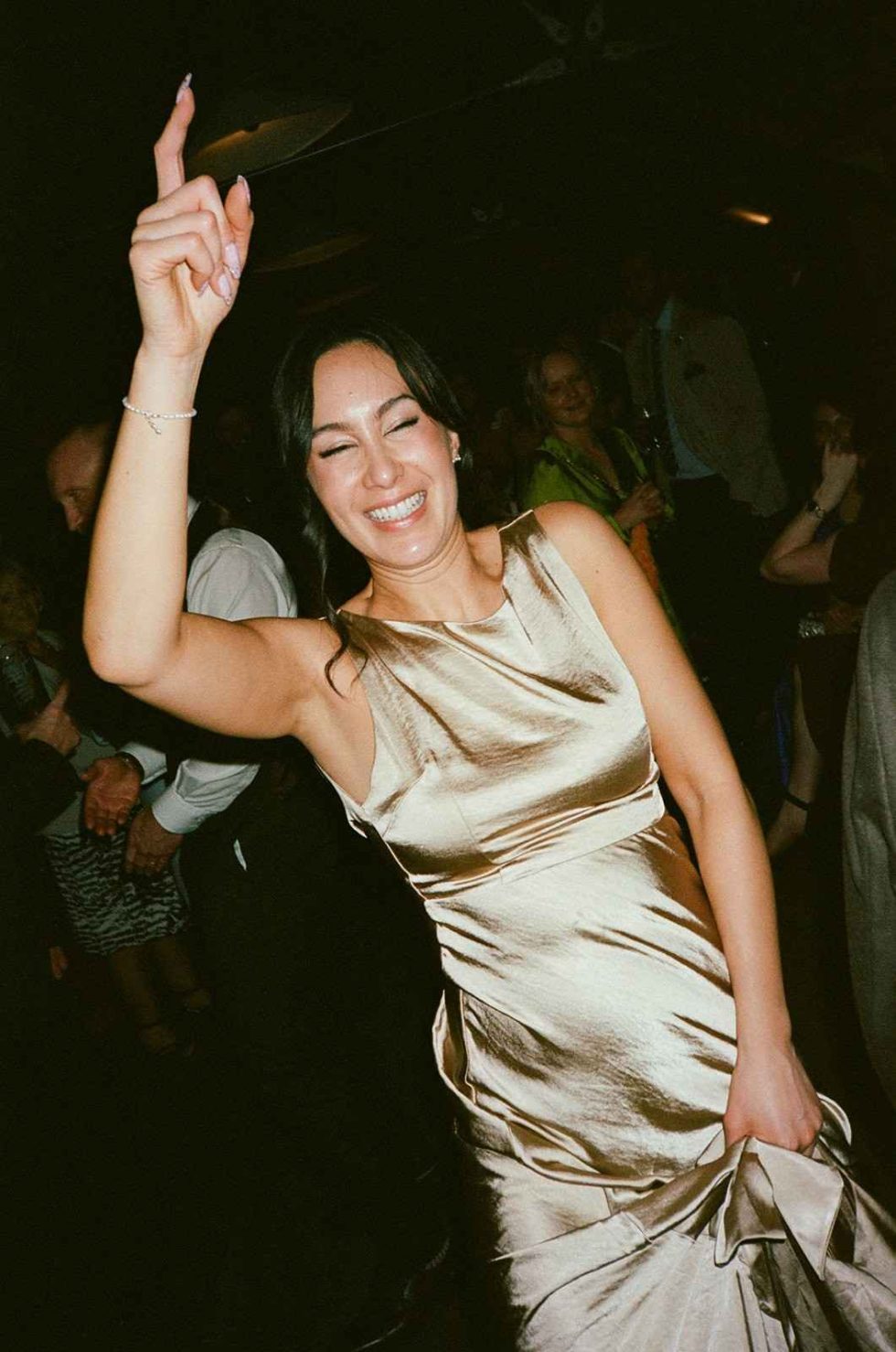 bridesmaid dancing at grangefields barn wedding on analogue film